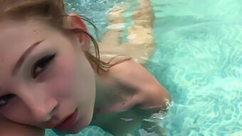 Swimming In Ecstasy: A Girl Pleasures Herself By The Pool