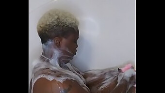 African-American Woman Enjoys A Sensual Bath And Massage