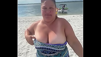 Duca Wife, A Provocative Bbw, Exposes Her Ample Bosom In A Public Beach Setting