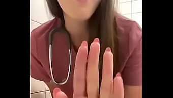 A Young Nurse Pleasures Herself In The Restroom