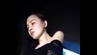 A Chinese Girl Performs A Sensual Striptease At A Nightclub