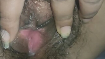 Desi teacher fingering an Indian girl's pussy in a pornographic style